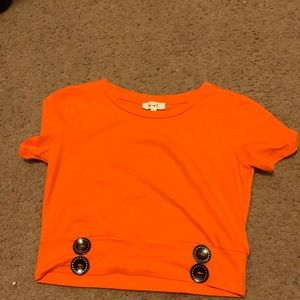 A nice orange crop top with black buttons